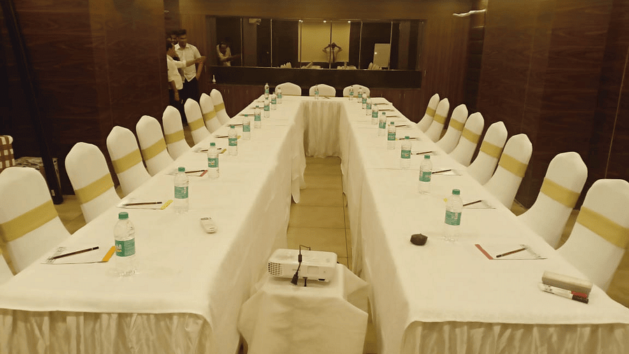 Image of a u-shaped table with chairs around it at Calux Grand Baga.